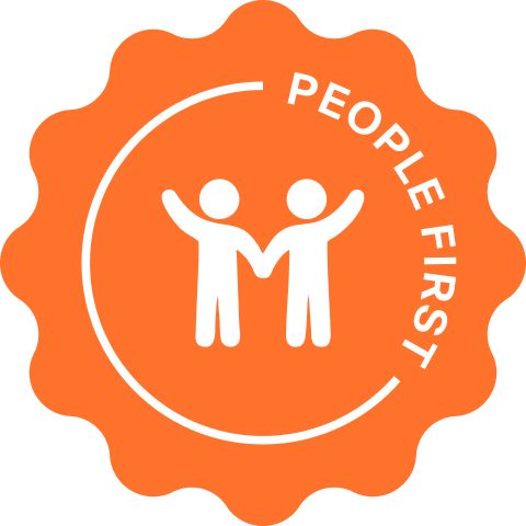 Capsule Hotel “People First” brand badge, orange seal with two figures holding hands and white text.