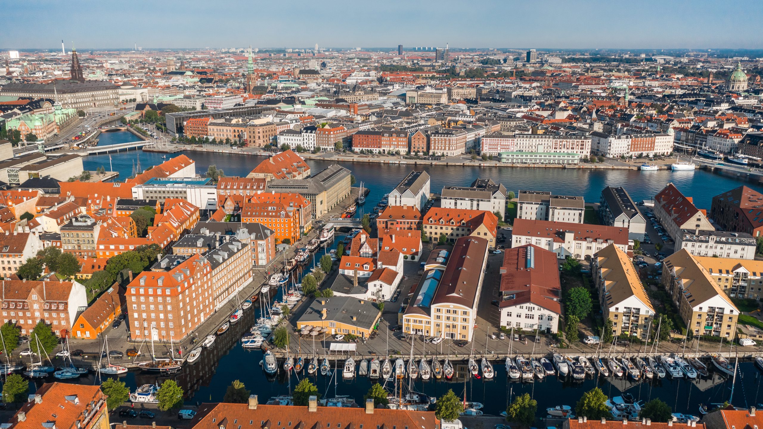 Copenhagen aerial view near Capsule Hotel Copenhagen Vesterbro, showcasing colorful architecture and waterways.