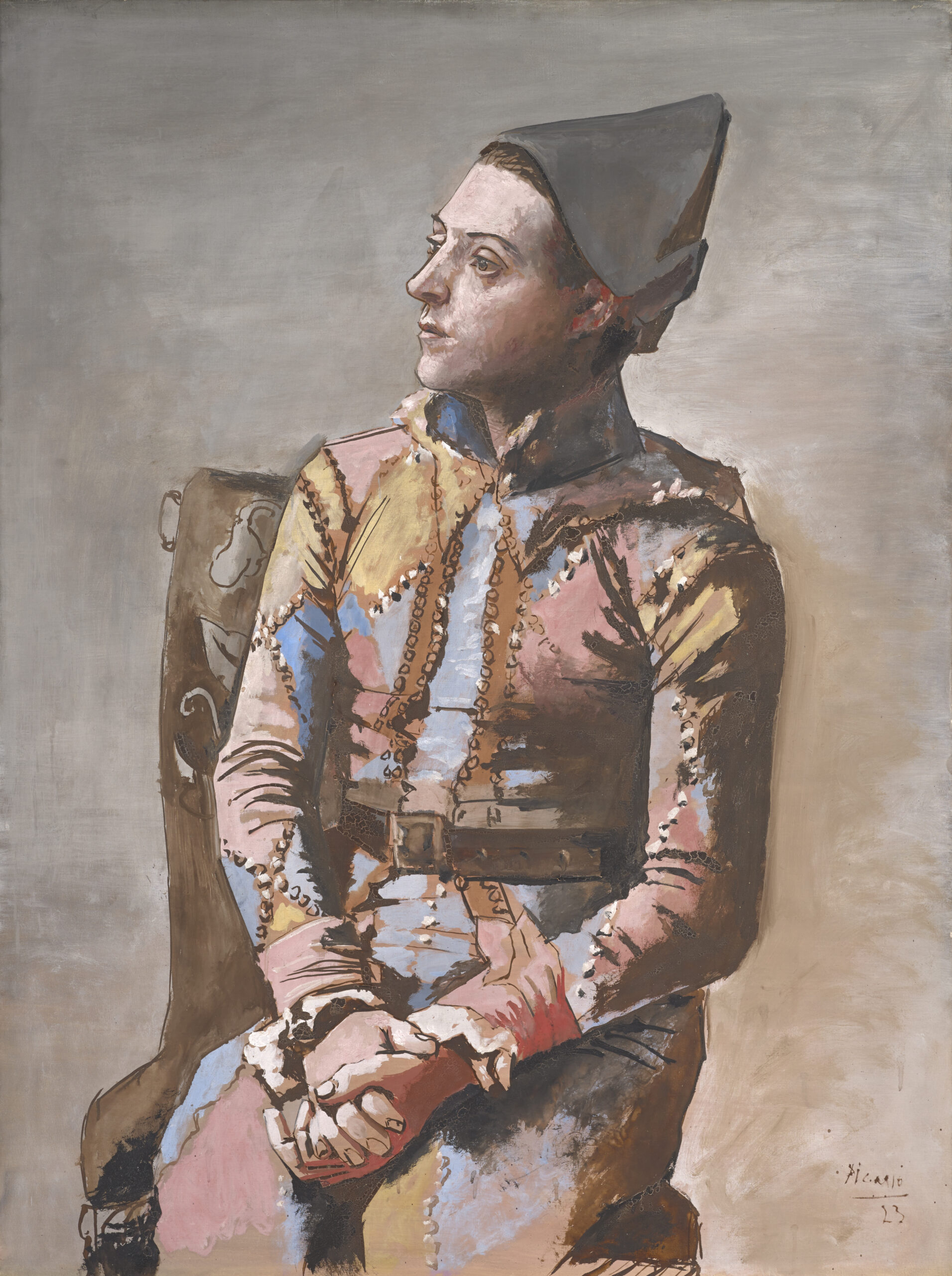 Picassos Gemälde aus dem Jahr 1923, das einen sitzenden Harlekin in einem pastellfarbenen Kostüm zeigt, Kunstmuseum Basel